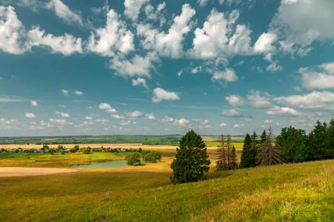 Panoramic high angle view of the plain, the village and the lake from hill to Stock Photos