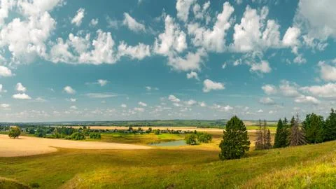 Panoramic high angle view of the plain, the village and the lake from hill to Stock Photos