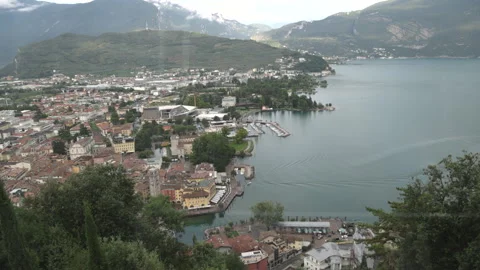 Panoramic high-angle view of Riva del Garda resort city, harbour, and surroundin Stock Footage 341332276