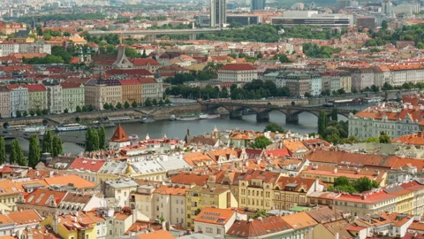 Panoramic high angle view shows the cityscape of Prague along Vltava River. Video stock 342024333