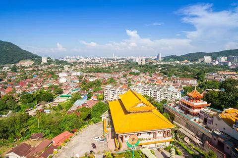 Panoramic high angle view of the yellow roof the Kek Lok Si temple in Georg.. Stock Photos