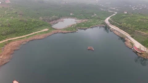 Panoramic High Drone Flight Revealing Vast Lake And Wilderness 4K 60fps Stock-Footage 335599867