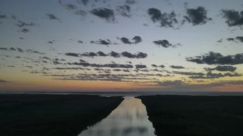 Panoramic high shot of big river and cloudy sky at sunset in South America Vidéo 151736012