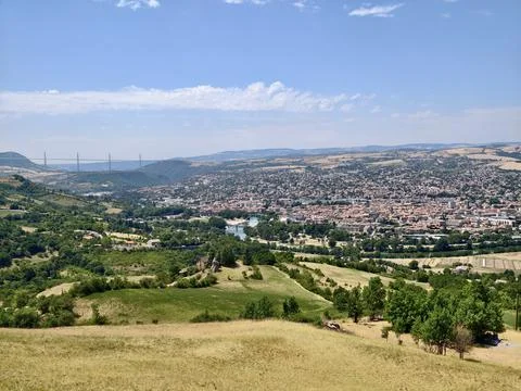 Panoramic hillside view over river valley town with distant cable stayed vi.. Stock Photos