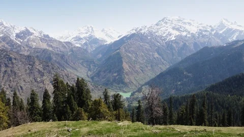 Panoramic Himalayan Mountain Landscape With Snow Capped Peaks and Forested Stock Footage 347125179