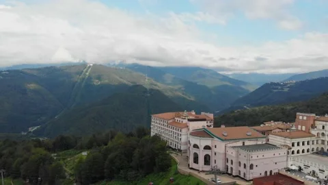 Panoramic hotel in the mountains, view from the drone. Beautiful buildings at Stock Footage 171565742