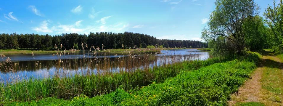Panoramic image of the road along the lake. Stock Photos