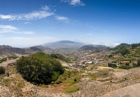 Panoramic image of small town on the mountain slope at valley Stock Photos