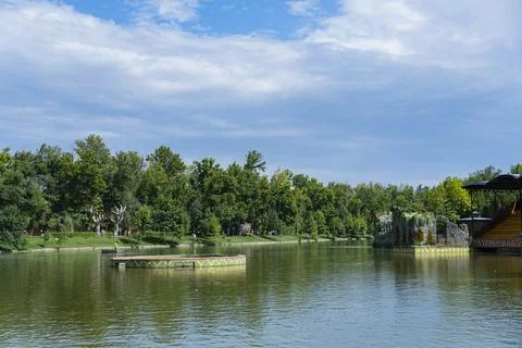 Panoramic lake view with dramatic blue sky in a public park Fotos Stock
