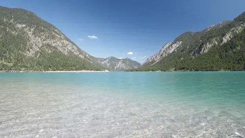 Panoramic Lake View of Plansee in Austria  Breathtaking Mountain Backdrop and Stock Footage 308647787