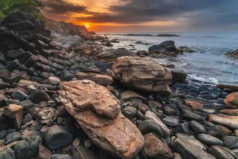 Panoramic landscape with basalt columns Ganh Da Dia on beach by sea. Da Dia reef Stock Photos