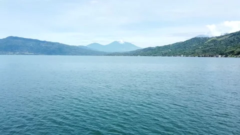 Panoramic landscape of beautiful Lake Singkarak with misty mountains view. Stock Footage 346276608