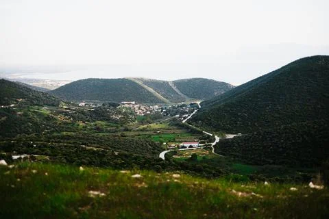 Panoramic Landscape with Forest Mountains Fields and Sea Distant Village Stock Photos