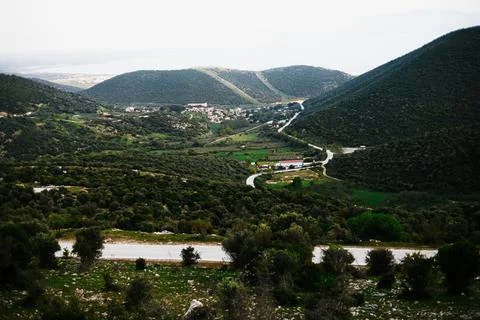 Panoramic Landscape with Forest Mountains Fields and Sea Distant Village Stock Photos