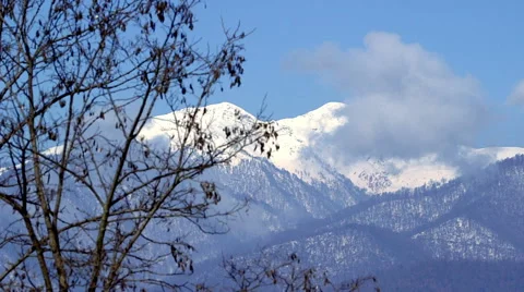 Panoramic landscape of mountain range under blue sky Stock Footage 62470098