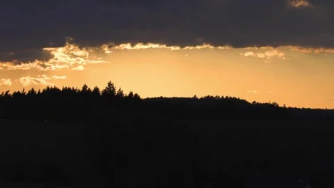 Panoramic landscape view captured during sunset as warm sky Stock Footage 345582517
