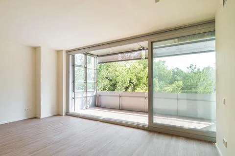 Panoramic large window to balcony from empty bedroom Stock Photos