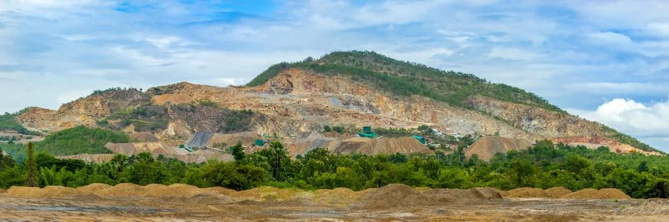 Panoramic of limestone quarry or mining industry on the mountain. Stock Photos