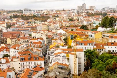 Panoramic Lisbon rooftops across hillside neighborhoods Stock Photos