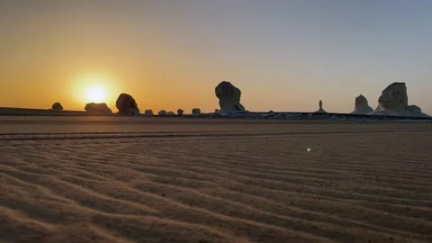 Panoramic low angle shot of desert sand ripples land white limestone formations Stock-Footage 340868895