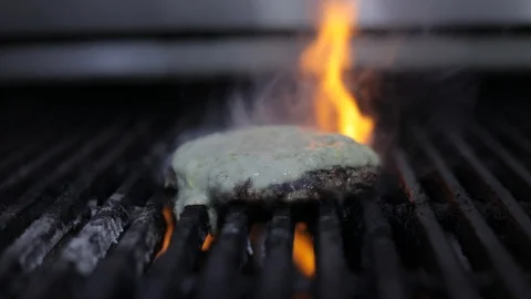 Panoramic of Meat Burger on Fire in the Grill with Gorgonzola Cheese Sauce Stock Footage 128463330