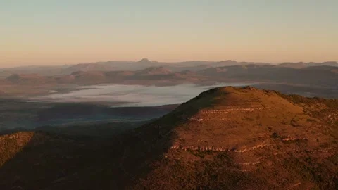 Panoramic misty African Rolling mountains at sunrise aerial drone wide Video stock 328522283