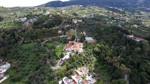 Panoramic monastery landscape with winding road forest and olive fields Stock Footage 344093994