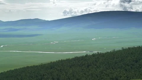 Panoramic Mongolian steppe shows rolling green hills - Wild Plains and Open Land Stock Footage 339707823