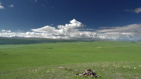 Panoramic Mongolian steppe shows rolling green hills - Open Plains and No People Stock Footage 339709745