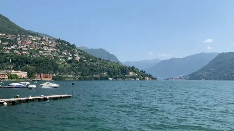 Panoramic motion view of Lago di Como lake. View from Cernobbio town pier Stock Footage 159570163
