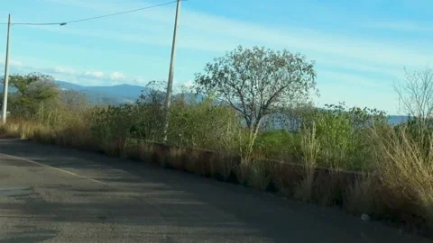 Panoramic Mountain and Valley View from Curved Road Stock Footage 297319410