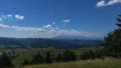 Panoramic Mountain Landscape with Distant Tatra Peaks Under Blue Sky Photos