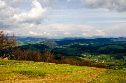 Panoramic mountain landscape with rolling green hills Stock Photos