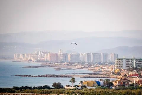 Panoramic of a mountain with a parapent Stock Photos