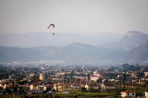 Panoramic of a mountain with a parapent Stock Photos