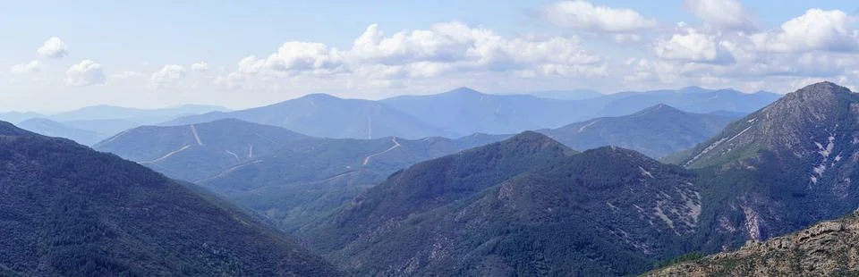 Panoramic of a mountain range with layered mountain peaks at dawn, Sierra de Stock Photos