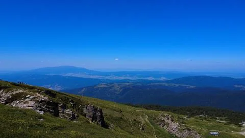 Panoramic Mountain Range Under Clear Blue Sky Stock Photos
