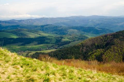 Panoramic mountain valley with green rolling hills Фото