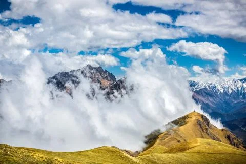 Panoramic mountain view with dramatic cloudy sky Stock Photos