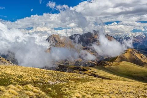 Panoramic mountain view with dramatic cloudy sky Stock Photos