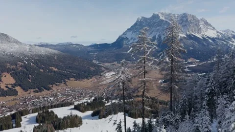 Panoramic mountain view of a winter valley with village and alpine peaks. Stock Footage 342580008