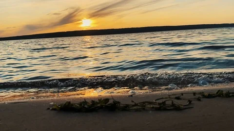 Panoramic movement to the left. Amazing sunset over the tropical beach 動画素材 114712967
