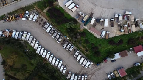 Panoramic municipal fleet yard with heavy vehicles and service infrastructure Stock Footage 344095075