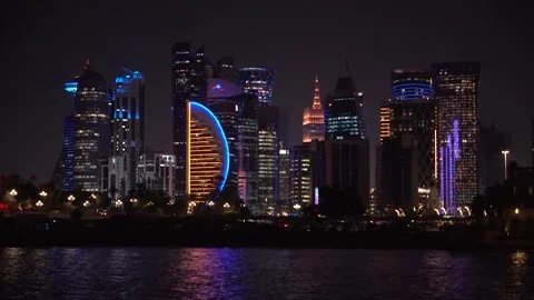 Panoramic night view of West Bay in Doha city. modern skyscrapers can be seen Stock Footage 303989775