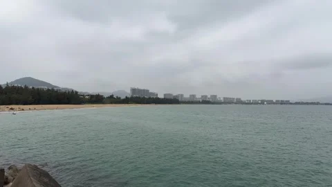 Panoramic Ocean View with Distant Beach and Urban Buildings 4K Stock Footage 331896842