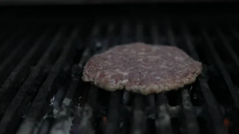 Panoramic (PAN) of Grilling Meat Burger Stock Footage 128463346