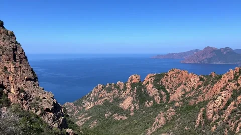 Panoramic panning view of calanques de piana rock formations in corsica Stock Footage 277548541