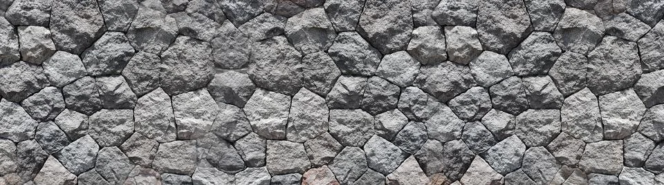 Panoramic Pebbles stone for background. Old brick wall from a stone. Stock Photos