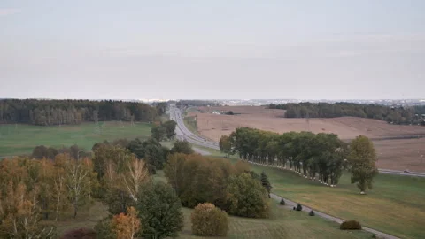 Panoramic road through fields and forests. Highway connecting the cities. Stock Footage 273862497