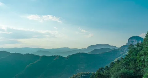 Panoramic rolling mountain ranges under a clear blue sky 스톡 동영상 342247517